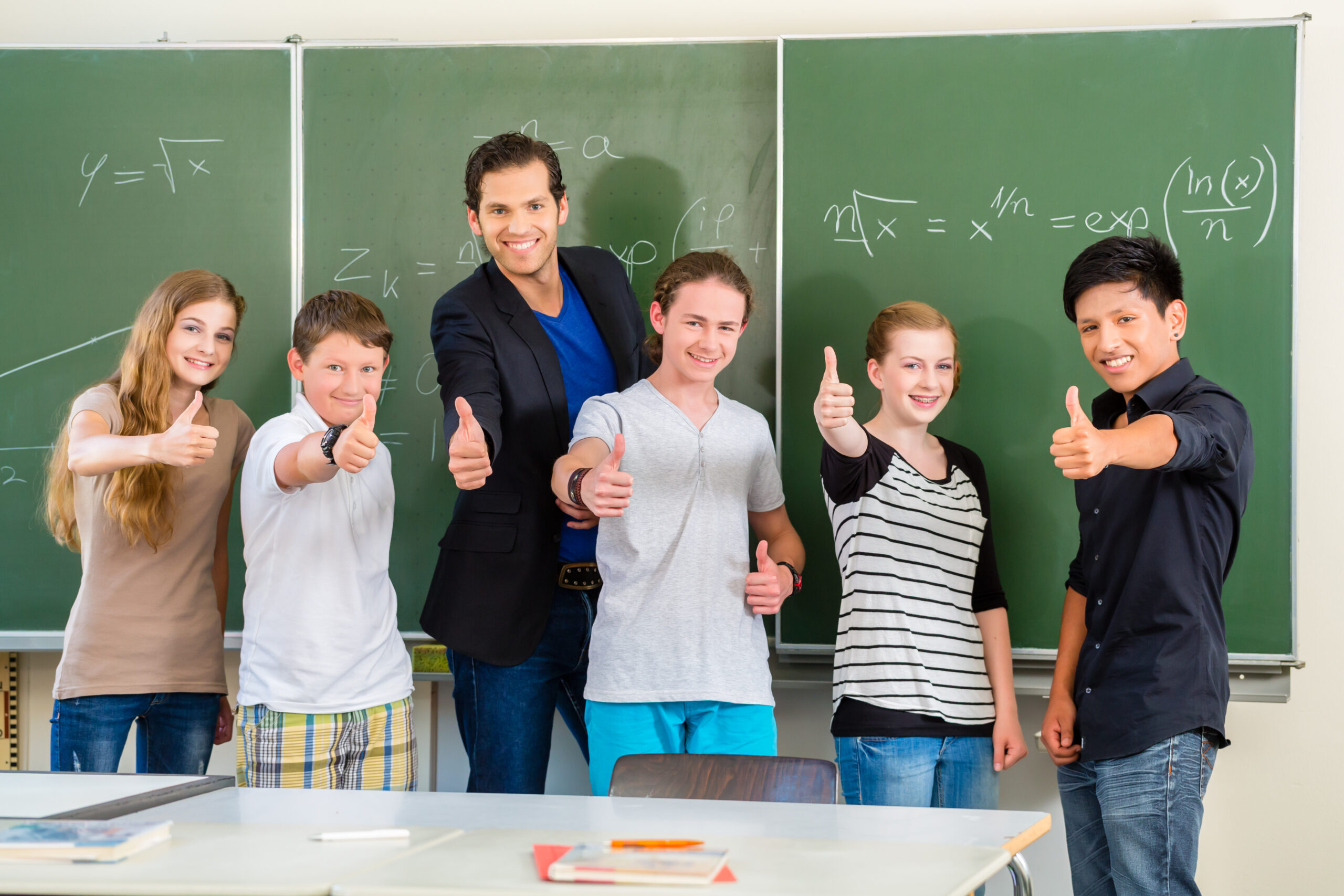 School,And,Education,-,Teacher,And,Students,Stand,In,Front